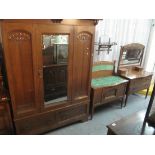 Early 20th Century oak three piece bedroom suite in Liberty style to include; mirrored wardrobe,