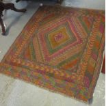 Gazak multi-coloured geometric rug. 135 x 120cm approx. (B.P. 24% incl. VAT)