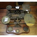 Two sets of 19th Century brass postal scales with fitted weights to their bases. (2) (B.P. 24% incl.