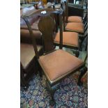 Set of four Victorian mahogany splat back upholstered dining chairs standing on carved cabriole legs