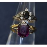 Two 9ct rings, one set with a purple stone with pierced shoulders. Weight 2.4g approx, ring size K