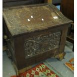 Early 20th Century carved oak coal bin with hinged lid, the interior revealing metal liner. (B.P.