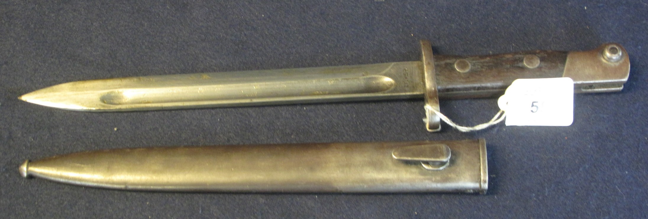 Enfield bayonet in scabbard with fullered blade and wooden scales, possibly Indian issue, blade