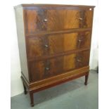 Mid Century mahogany tall boy having three large straight fronted drawers on tapering legs and spade