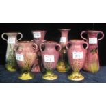 A collection of seven Torquay pottery Lemon and Crute two handled and other vases of varying forms
