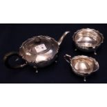 Silver baluster shaped three piece tea set with indented moulded rim. Birmingham hallmarks. (3) (B.
