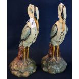 A pair of unusual polychrome painted case iron door stops in the form of herons. Probably 19th