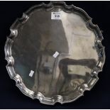 Large silver plated piecrust edge presentation salver on three ball and claw feet. (B.P. 24% incl.