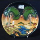 Modern Moorcroft art pottery tube lined cabinet plate or charger, overall depicting a forest and