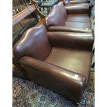 Modern burgandy leather three piece suite comprising two seater sofa and a pair of armchairs. (3) (
