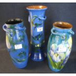 Three Torquay pottery Lemon and Crute vases, one of tapering form decorated with flowers, birds