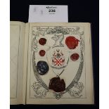 Interesting album of crests and bookplates Together with a chapter of Mottoes and Classical