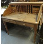 Modern pine desk with fitted drawers and compartments standing on turned legs. (B.P. 24% incl. VAT)