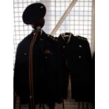 Two British army officer's no. 1 dress uniforms in dark blue with jacket, trousers, cap and belt. (