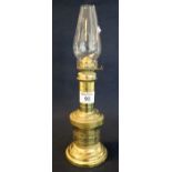 Brass single burner oil lamp, base marked La Lampe Pompe Francaise circa 1750, with glass shade. (
