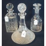 Three glass decanters of varying forms including mallet shaped and a ship's type decanter, all