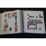 All world mint and used stamp collection in two large blue albums. Many 100s of stamps, good range