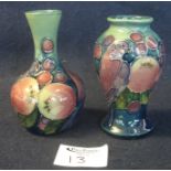 Two similar Moorcroft art pottery tube lined finches and berries vases. Both approx 10.5cm high.