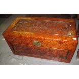 Modern stained camphor wood chest, carved with dragons amongst clouds. (B.P. 24% incl. VAT)