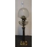 Late Victorian brass double burner oil lamp with moulded glass reservoir on brass corinthian