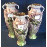Pair of Torquay pottery two handled vases by Lemon and Crute, overall decorated with birds and