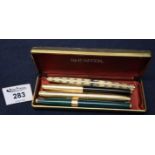 Two Sheaffer gilt finished fountain pens and two Parker fountain pens, in Shaeffer box. (B.P. 24%