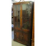 Early 20th Century oak Jacobean two door display cabinet on bun feet. (B.P. 24% incl. VAT)