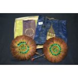 Two natural feather circular fans, together with embroidered silk ceremonial striped bags possibly