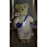 Mid 20th Century teddy bear with stitched nose, padded arms and feet and movable limbs in fitted