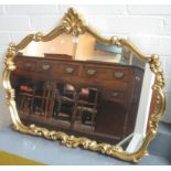 Modern gilt framed mirror with shell motif. (B.P. 24% incl. VAT)