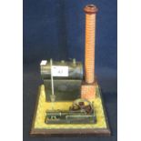 A Bing German brass and tinplate stationary engine on square base. (B.P. 24% incl. VAT)