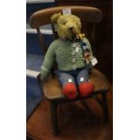 Vintage filled teddy bear with knitted costume, together with a small beech and elm child's