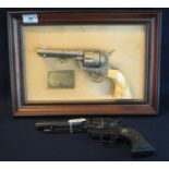 Two diecast metal replica colt revolvers, 'TheJohn Wayne Western commemorative .45 single action',
