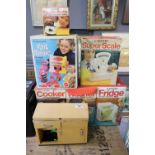 Casdon battery operated cooker, washer, fridge, super scale and electric kettle in original boxes.