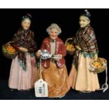 Three Royal Doulton bone china figurines to include; 'The Orange Lady' HN1759 x 2 and 'Teatime'