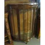 1930's bow front glazed display cabinet on cabriole legs. (B.P. 24% incl. VAT)