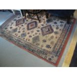 Savannah geometric rug, the central field with lozenge panels and stylised trees, made in