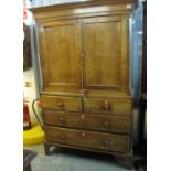 Early 19th Century Welsh oak two stage blind panelled press cupboard with an arrangement of four