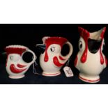 A set of three graduated novelty Healacraft stylised cockerel or chicken single handled jugs. (3) (