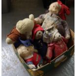 Box containing five Paddington bears, various attire, including blue and red hats and blue and red