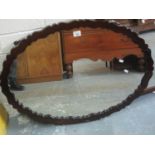 Early 20th Century mahogany framed mirror with shaped frame. (B.P. 24% incl. VAT)