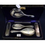 Cased silver backed dressing table set of brushes, comb, mirror etc. Birmingham hallmarks. (B.P. 24%