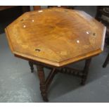 Victorian walnut inlaid octagonal centre or side table on ring turned supports and casters. (B.P.