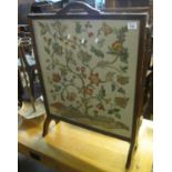 Early 20th Century oak framed firescreen with multi-coloured flowers and foliage. (B.P. 24% incl.