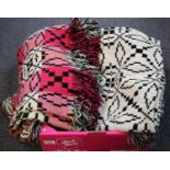 Two vintage woollen geometric design Welsh tapestry blankets, one pink ground the other cream. (