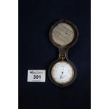 Cased gilt metal pocket barometer, the face marked A Casartelli of Liverpool, in leather covered