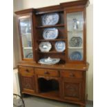 Late 19th Century oak two stage cabinet back dog kennel dresser with carved panels on turned