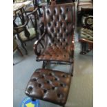 Chesterfield style burgandy leather button back open rocking armchair with similar stool. (2) (B.