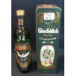 Single malt Glenfiddich pure malt Scotch whisky, 750ml, in tin box with man in kilt. (B.P. 24% incl.