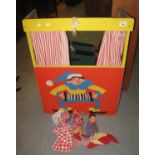 Child's folded wooden and painted Punch & Judy theatre with 3 puppets. (B.P. 24% incl. VAT)